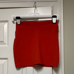 Orangey red mini skirt